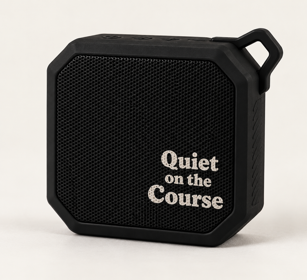 Quiet on the Course Bluetooth speaker in black with white halftone lettering, front view